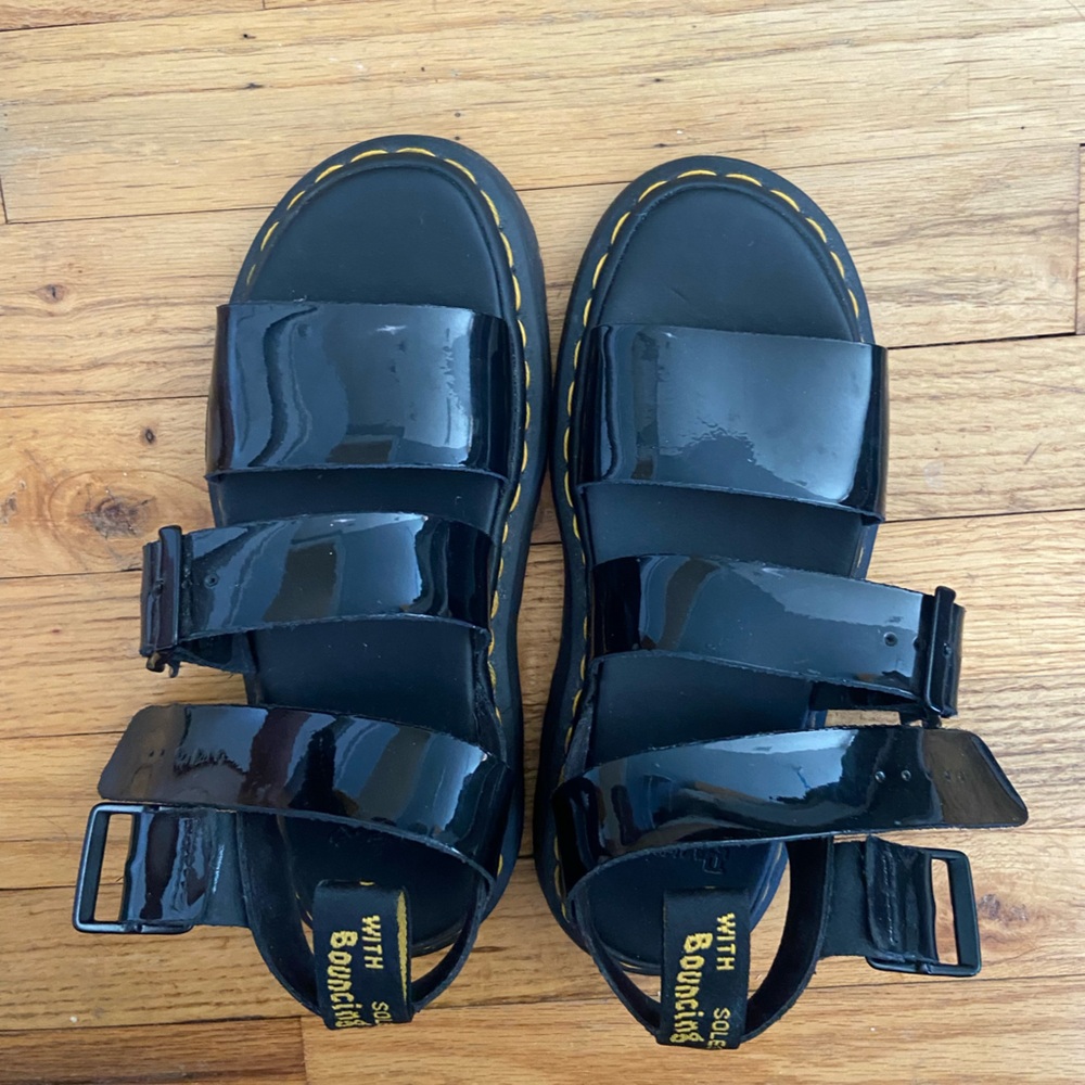 Black Dr. Martens Gryphon patent leather sandals